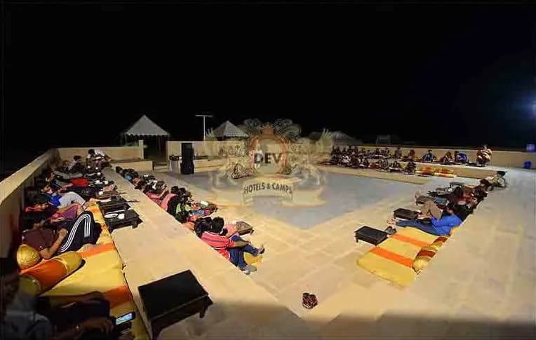 Guests seated around the amphitheatre during a performance