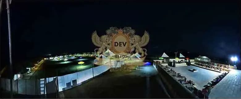 The camp amphitheatre and grounds lit up at night