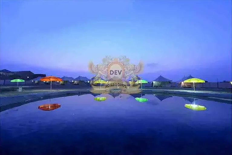 Camp e Khas at night reflected in the Talai pond